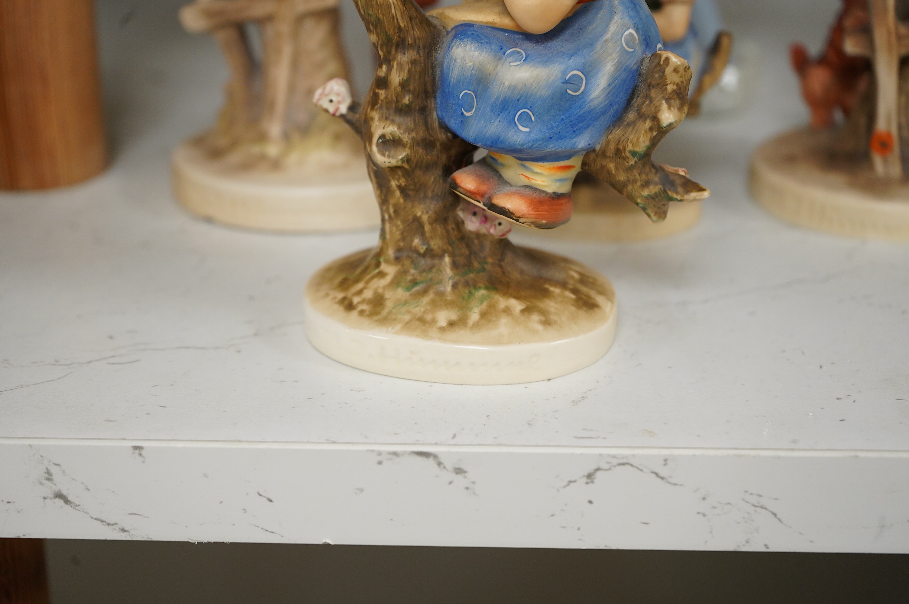 Six various Goebel figures and a Lladro figure, 24cm high